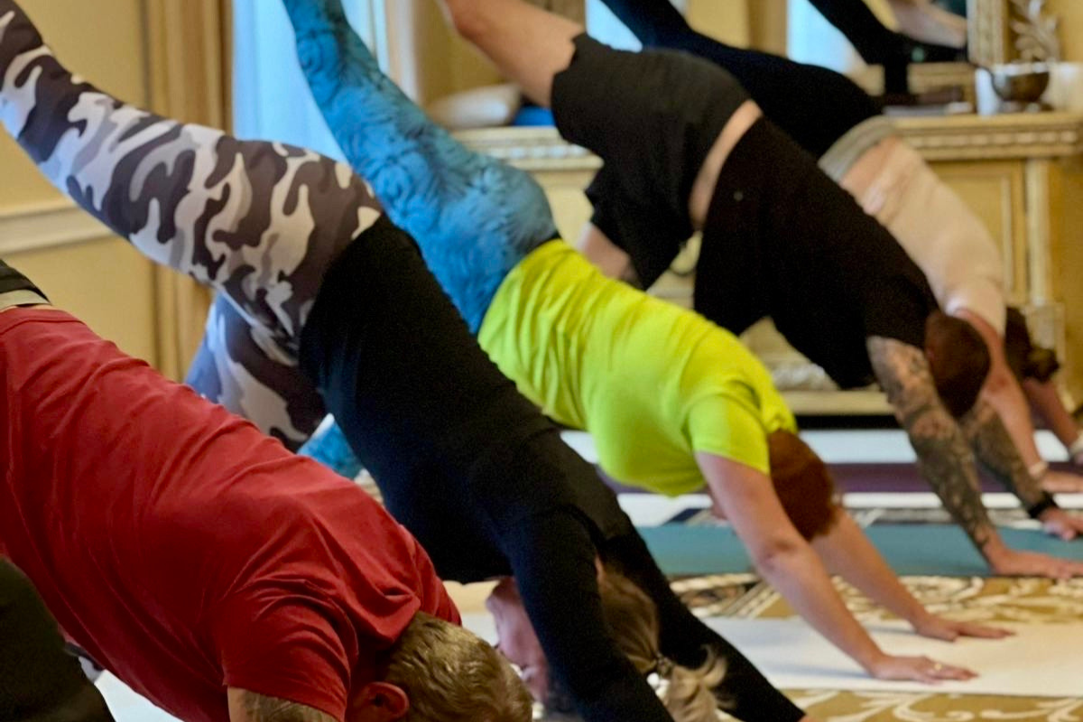 group of people doing yoga at the castle